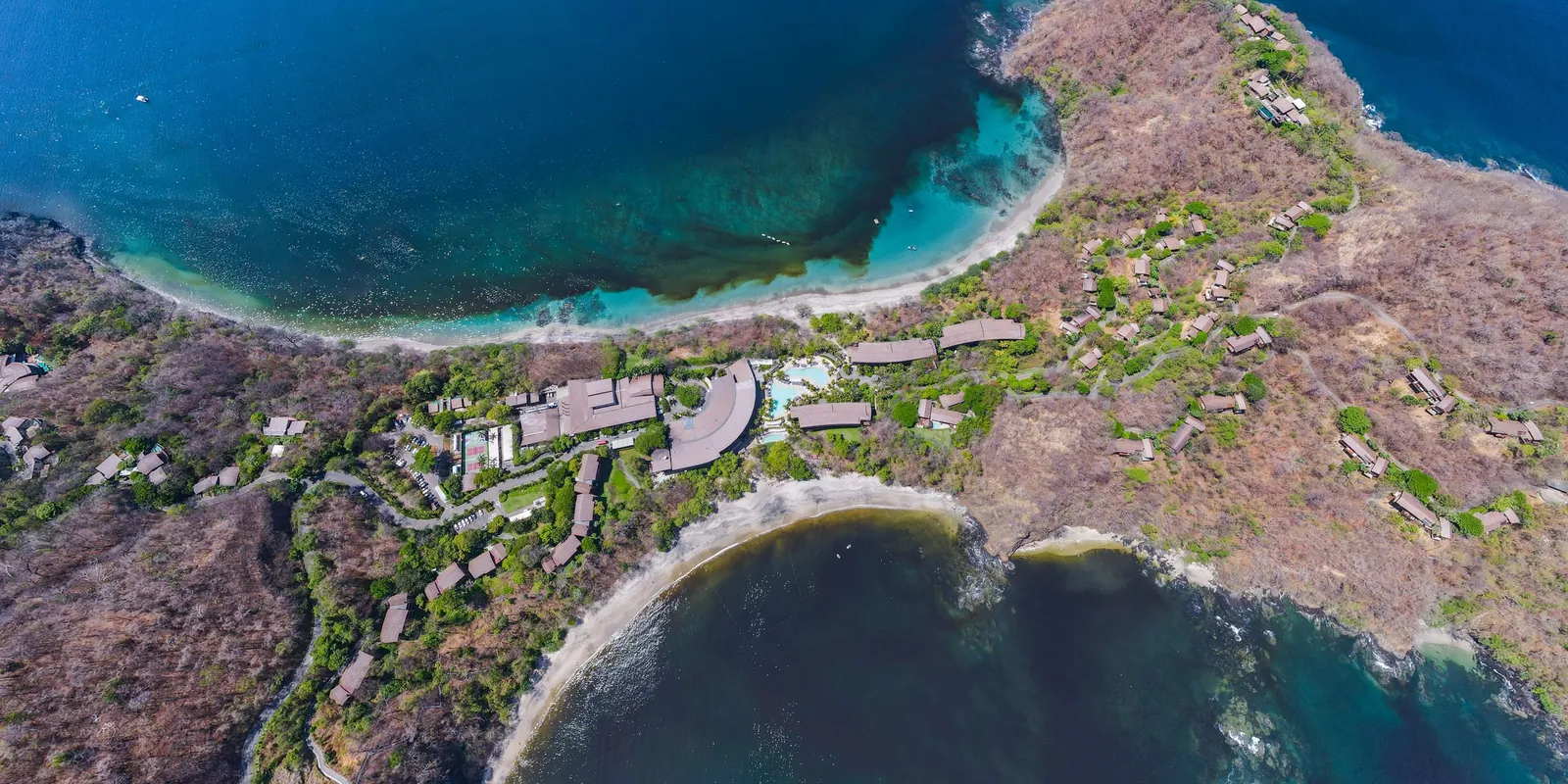 Aerial view of a dry-forest headland between two coves in the Gulf of Papagayo