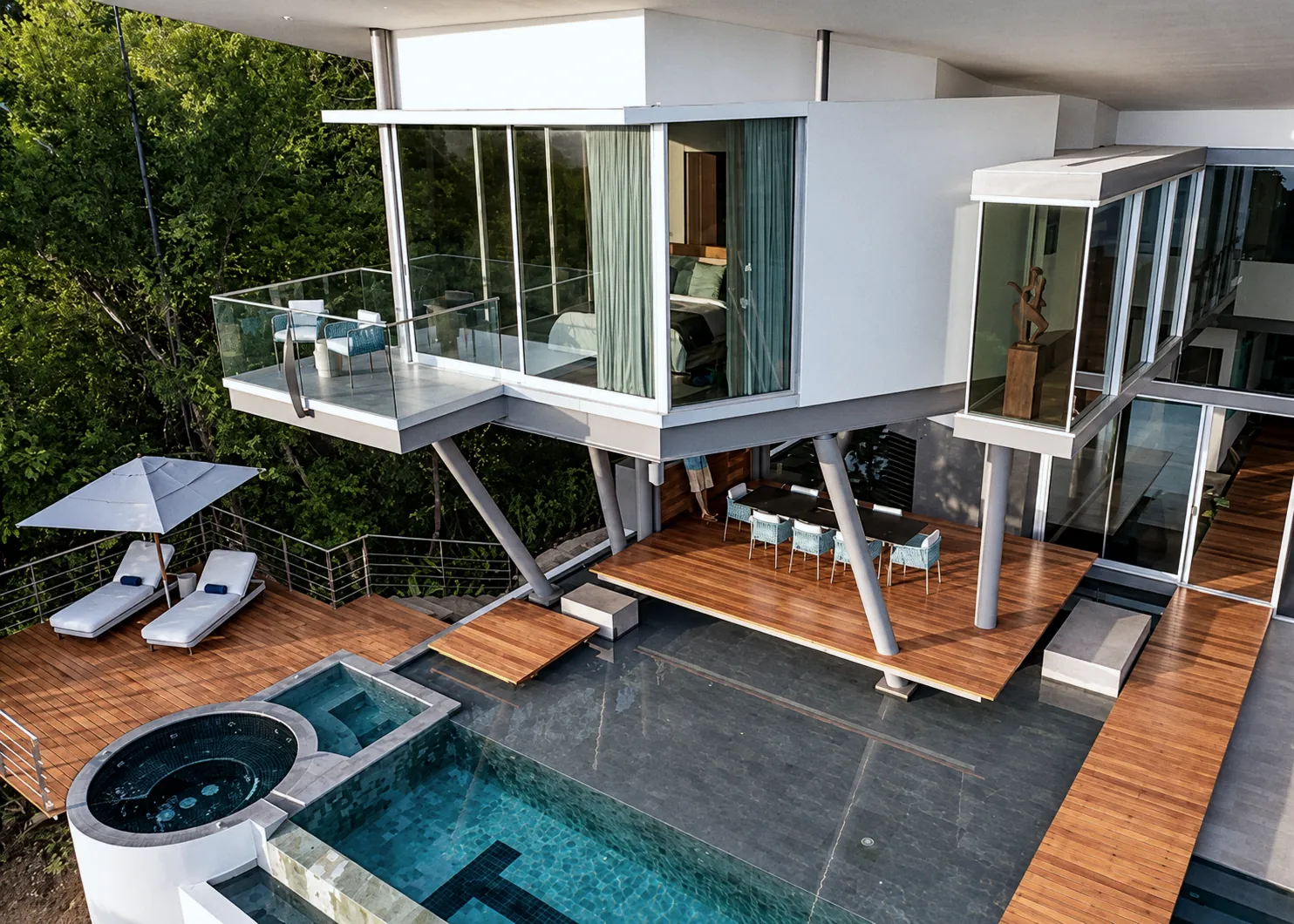 Aerial view of the pool, the plunge pool and the timber decks below the cantilevered bedrooms